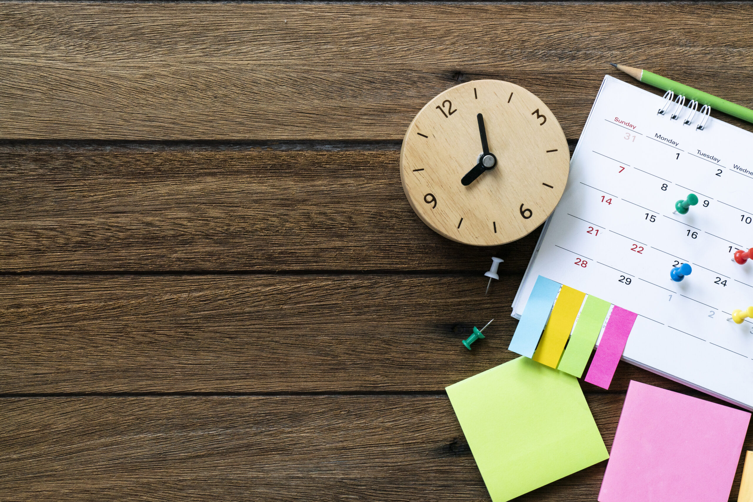 close up of calendar and clock on the table, planning for business